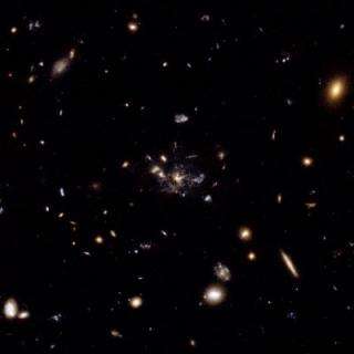Flies in a spider's web: Galaxy caught in the making