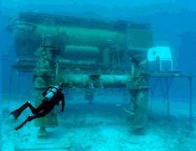 A diver approaches the Aquarius undersea research laboratory