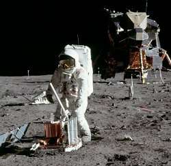 Buzz Aldrin deploys a seismometer in the Sea of Tranquillity.