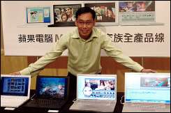 A man displays three types of the MacBook series