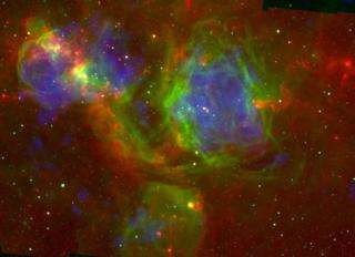 This false-color image shows infrared (red), optical (green), and X-ray (blue) views of the large star-forming complex N51