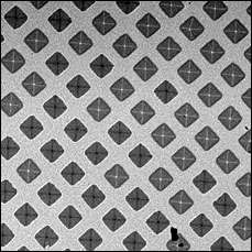 Pattern of magnetic squares showing two distinct polarities in black and white