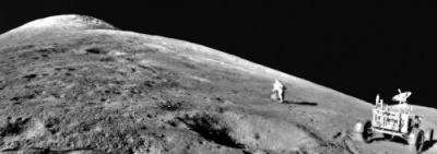 Apollo 15 astronaut Dave Scott ascends the cushiony base of Mt. Hadley Delta