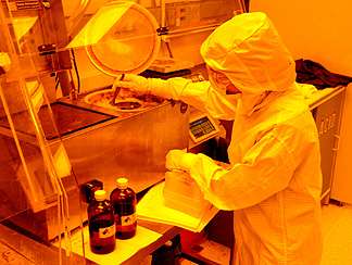 A student learns clean room processes necessary for nanotechnology as part of the NNIN's Research Experience for Undergraduates
