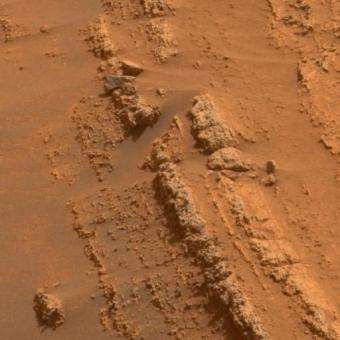Mars Rovers Head for New Sites After Studying Layers