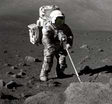 Apollo 17 geologist Harrison "Jack" Schmitt scoops up some oxygen-rich moon rocks and soil
