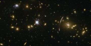 Hubble sees 'Comet Galaxy' being ripped apart by galaxy cluster