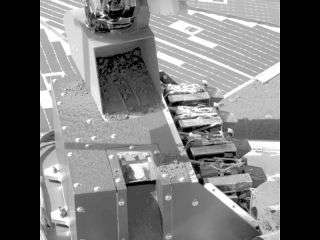 Phoenix Mars Lander Delivers Soil Sample to Microscope