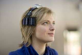 Wireless EEG system self-powered by body heat and light