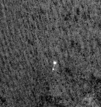Camera on Mars Orbiter Snaps Phoenix During Landing