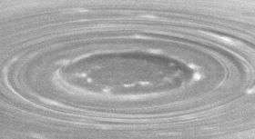 Giant Cyclones at Saturn's Poles Create a Swirl of Mystery
