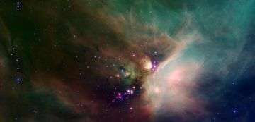 Spitzer Catches Young Stars in Their Baby Blanket of Dust