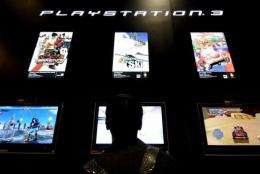 A man tries a game for Sony's game console Playstation 3