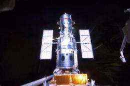 Atlantis astronauts who fixed Hubble earn day off (AP)