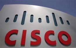 Cisco earnings fall 46 pct but upturn expected (AP)