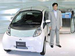 Mitsubishi Motors President Osamu Masuko introduces the company's first mass production electric vehicle "iMiEV"