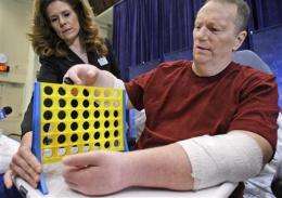 1st US 2-hand transplant patient yearns to feel (AP)