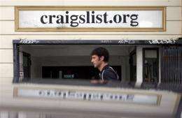 A man walks past the office of online site Craigslist in San Francisco, California