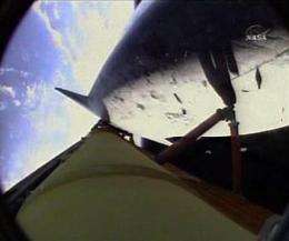 Astronauts inspect space shuttle for launch damage (AP)