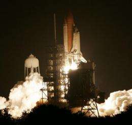 Space shuttle blasts off, finally flying on try 3 (AP)