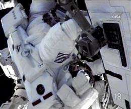 Astronauts install fresh batteries on spacewalk 4 (AP)