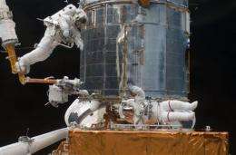 Astronauts take final spacewalk for Hubble repairs (AP)