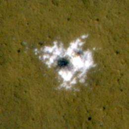 Scientists see water ice in fresh meteorite craters on Mars