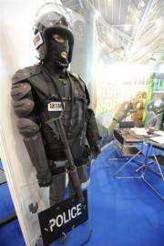 A display of police anti-riot outfit gear is shown at the Global Security Asia exhibition