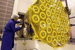 A European Space Agency technician works on a satellite, scheduled to be part of the Galileo network