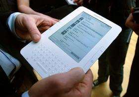 A man holds the new Amazon Kindle 2