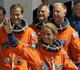 Astronauts board space shuttle for evening launch (AP)
