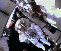 Astronauts cut spacewalk short due to suit trouble (AP)