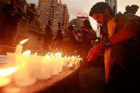 Candles are lit at a rally in support of Iranian election protesters organized by Amnesty International in New York