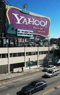 Cars drive by a Yahoo billboard