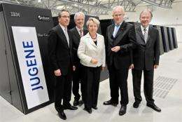 Chairman of IBM Germany Martin Jetter (left) with other officials in front of the "Jugene" supercomputer