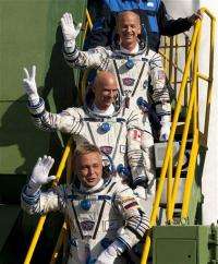 Circus tycoon, 2 crew board orbiting space station (AP)