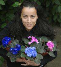 Dr. Nadia Kadi with African Violets