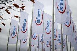 Flags with the logo of chip maker Infineon fluttering at the Munich fairgrounds