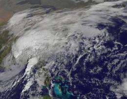 GOES satellite sees bulk of Ida's clouds and rain inland while center making landfall