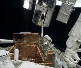 Hubble departs shuttle for new discoveries (AP)