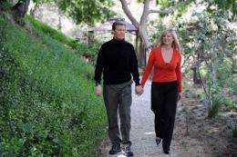 Kent Shocknek, CBS morning television news anchor, walks with his wife Karen in their garden created by Robert Cornell