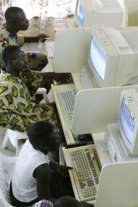 Locals surf the internet at a cybercafe in Bouake