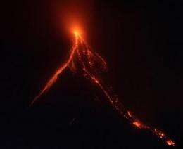 More Filipinos leave homes as volcano spills lava (AP)