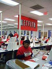 Netflix workers sort DVDs at the company's Piscataway, New Jersey, distribution center