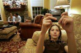 No texting at dinner! Parenting in the digital era (AP)