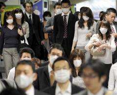 NYC has first swine flu death; cases soar in Japan (AP)