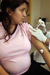 Pregnant? Get a flu shot _ but it may be a hassle (AP)