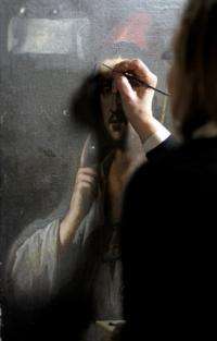 Recent picture of art study professor and specialist of Italian master Caravaggio, Roberta Lapucci, restoring a painting