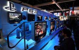 Showgoers try out games at a PlayStation 3 exhibit