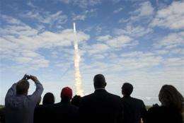 Shuttle nears space station, docking scheduled (AP)